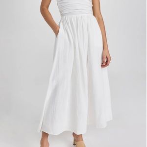 White strapless midi dress. Never worn, side zip closure, lined with pockets